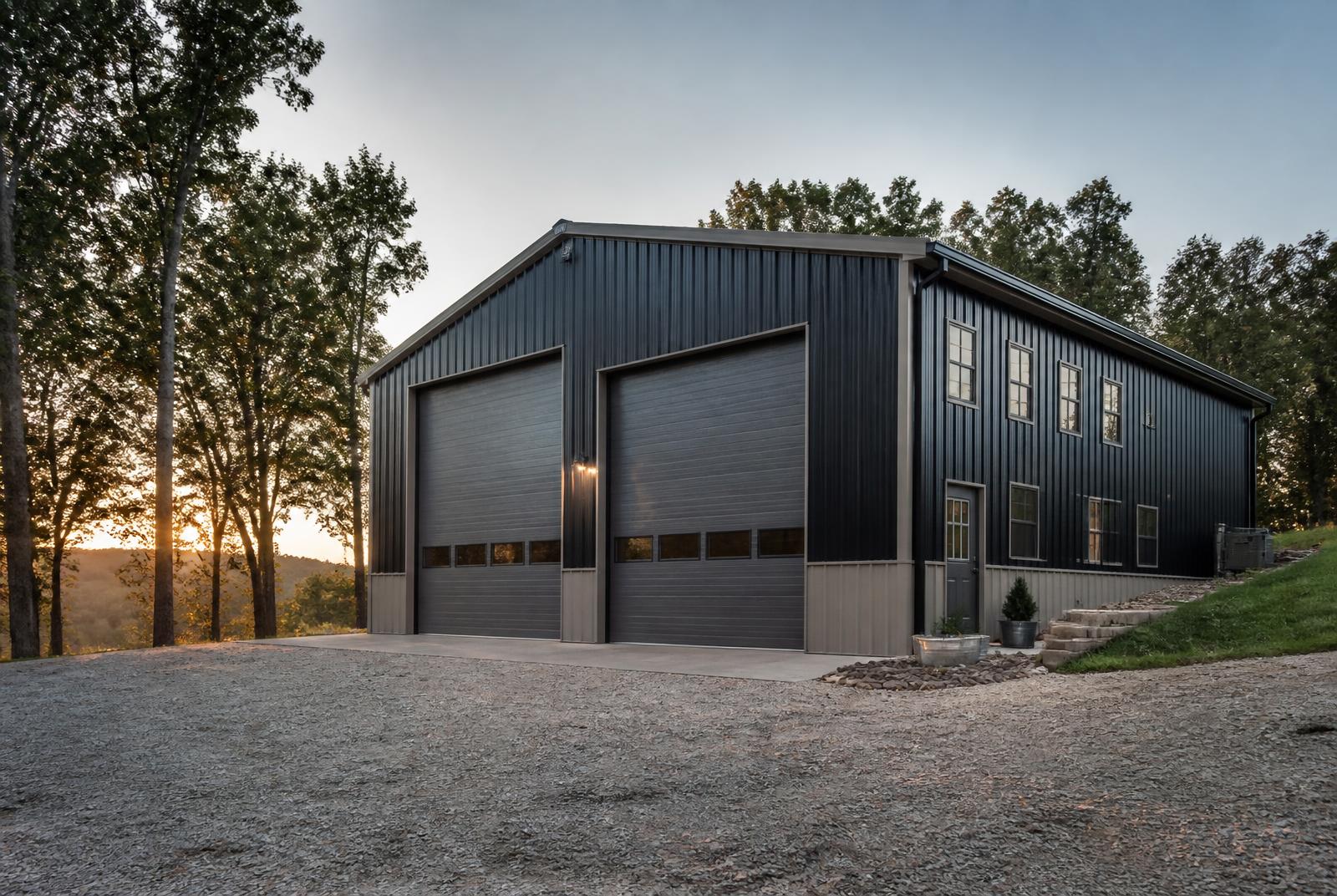 Representative image of a large charcoal metal workshop building with tall overhead doors